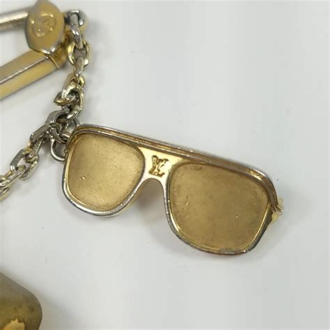 louis vuitton charm sunglasses|louis vuitton key pouch wallet.